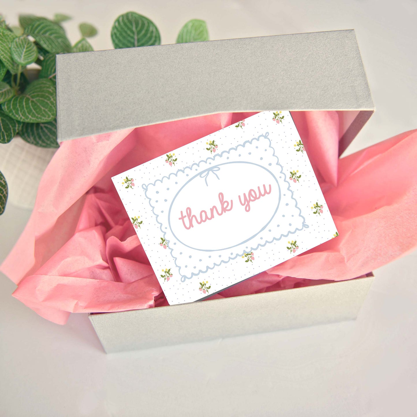 customer thank you business cards in cute coquette pattern of strawberry sprigs and tiny polka dots.  Front of customer thank you card says thank you in pink with hand drawn frame and bow.