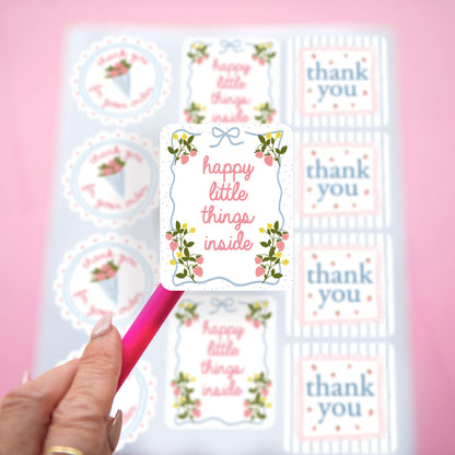 cute hand drawn design customer thank you stickers with strawberry coquette theme and pink and blue colors.  Saying Happy little things inside, thank you for your order, and thank you.